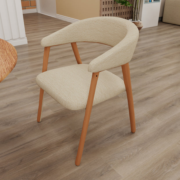 Sable Curve dining chair in beige upholstery with curved wraparound back and natural wood frame.