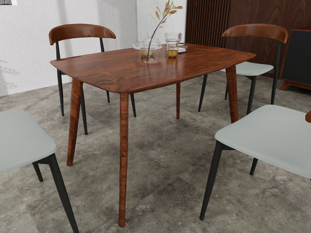 Arbor dining table styled with cream chairs in dining room